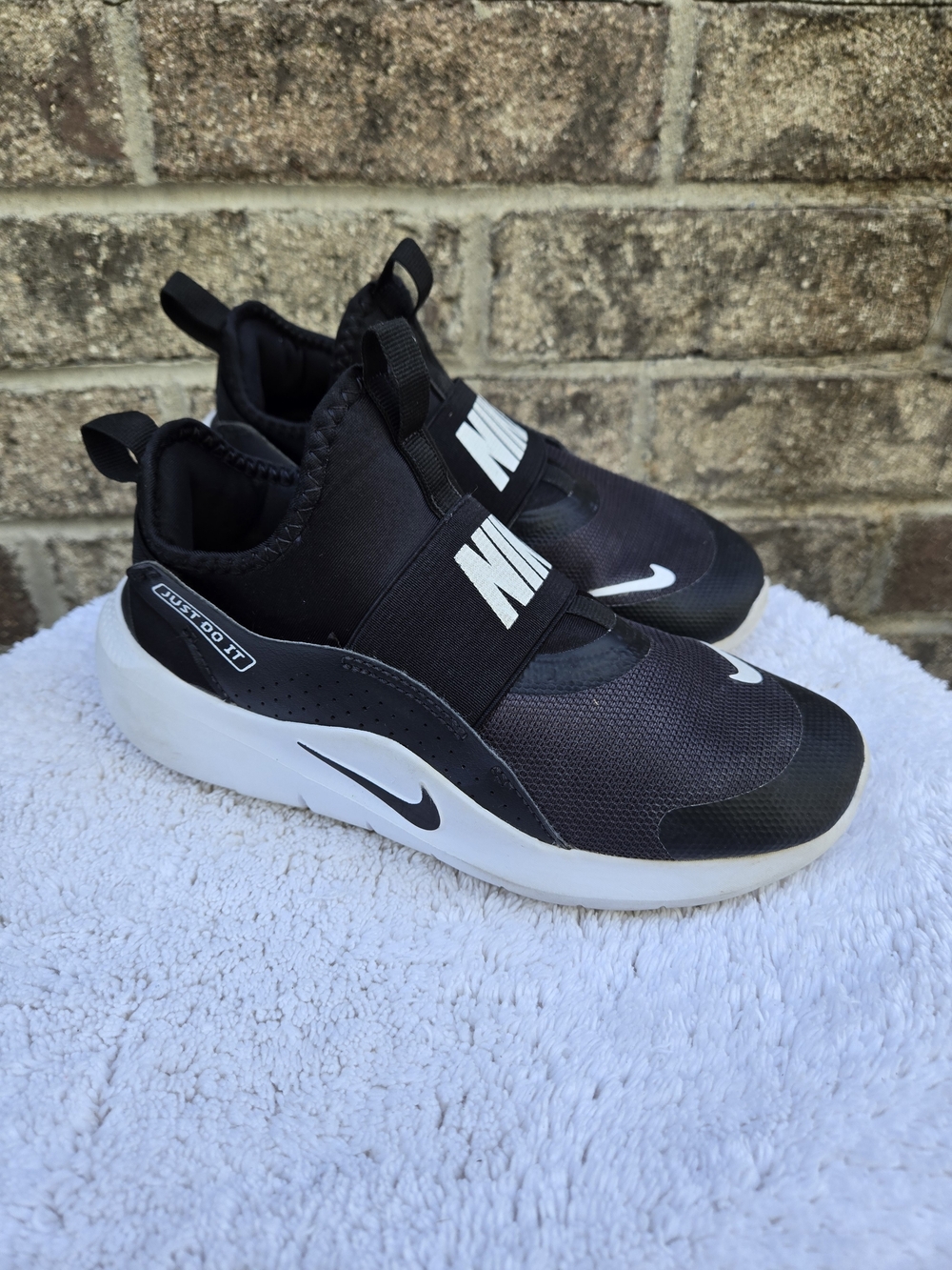 Nike Kids' Black and White Slip-On Athletic Shoes